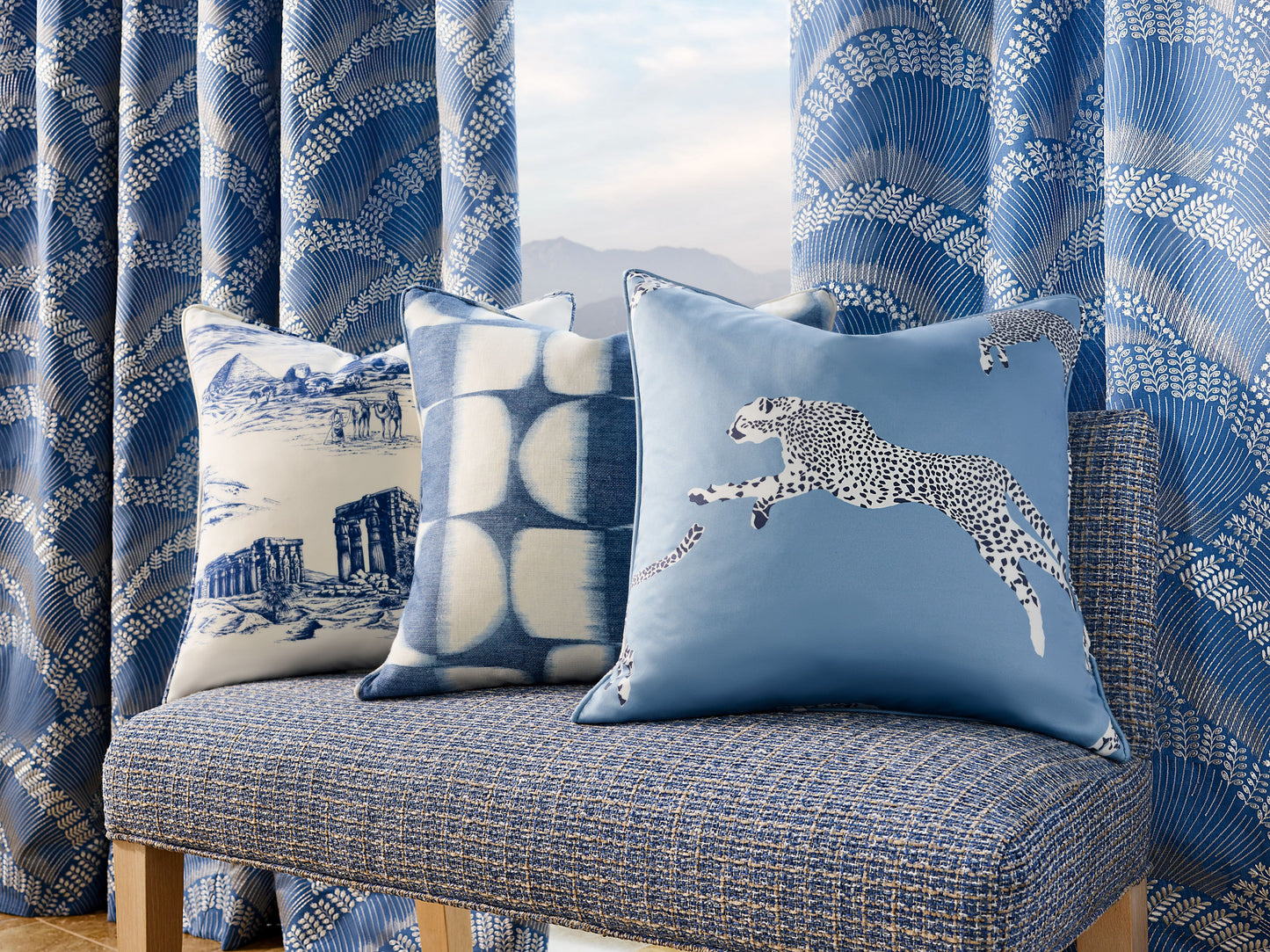 Blue embroidery fabric with a textured weave.