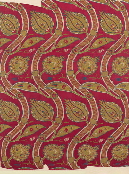Red fabric with gold curved vines, olive leaves and round floral medallions; ornate repeating botanical upholstery print.