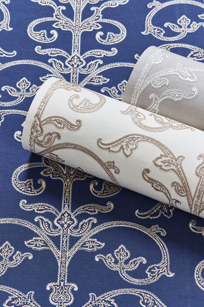 Damask wallpaper rolls in blue, white & gray tones with ornate scroll patterns for interior walls.