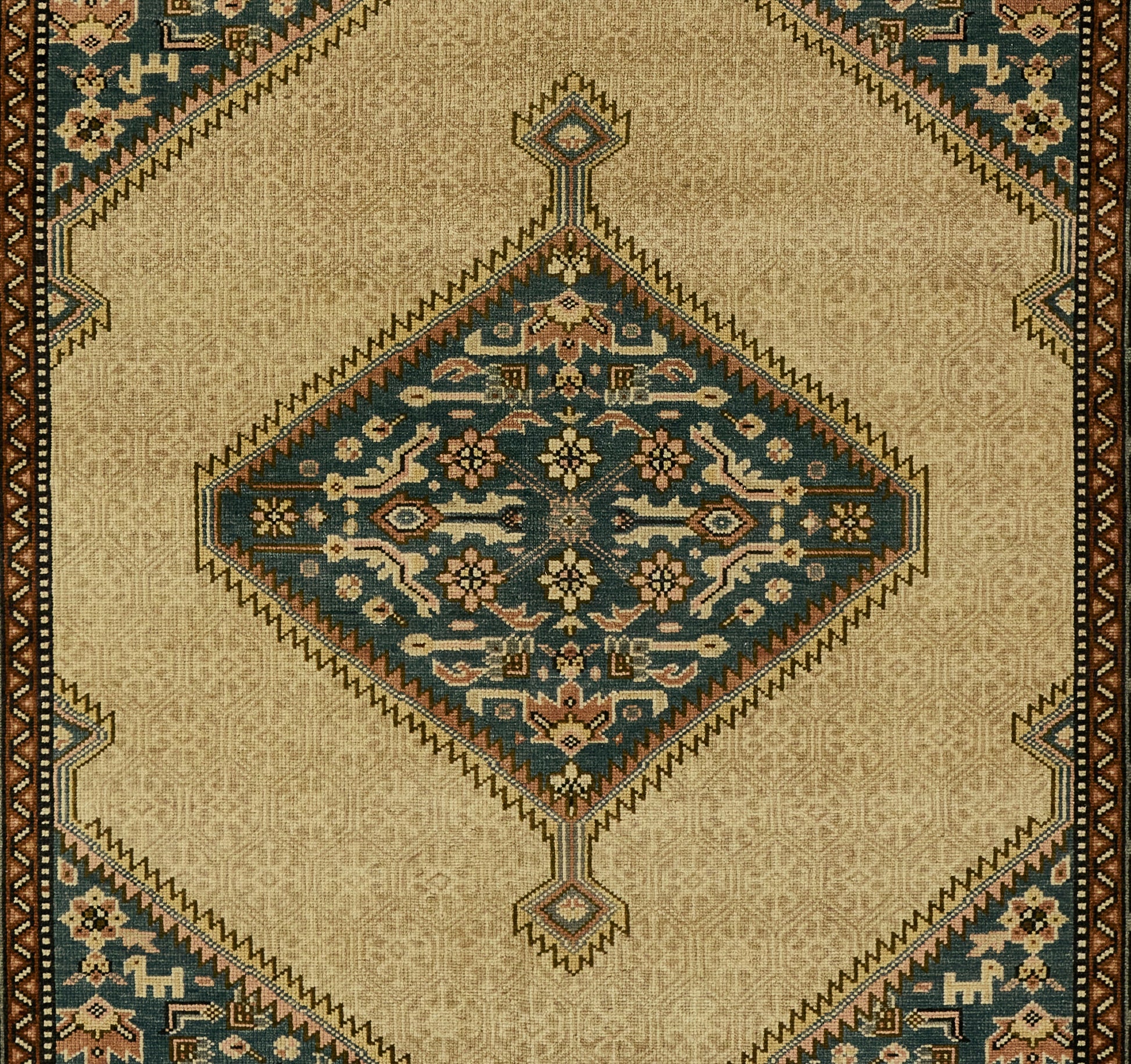 Traditional oriental wool rug with beige field, blue diamond medallion, floral motifs, and brown border.
