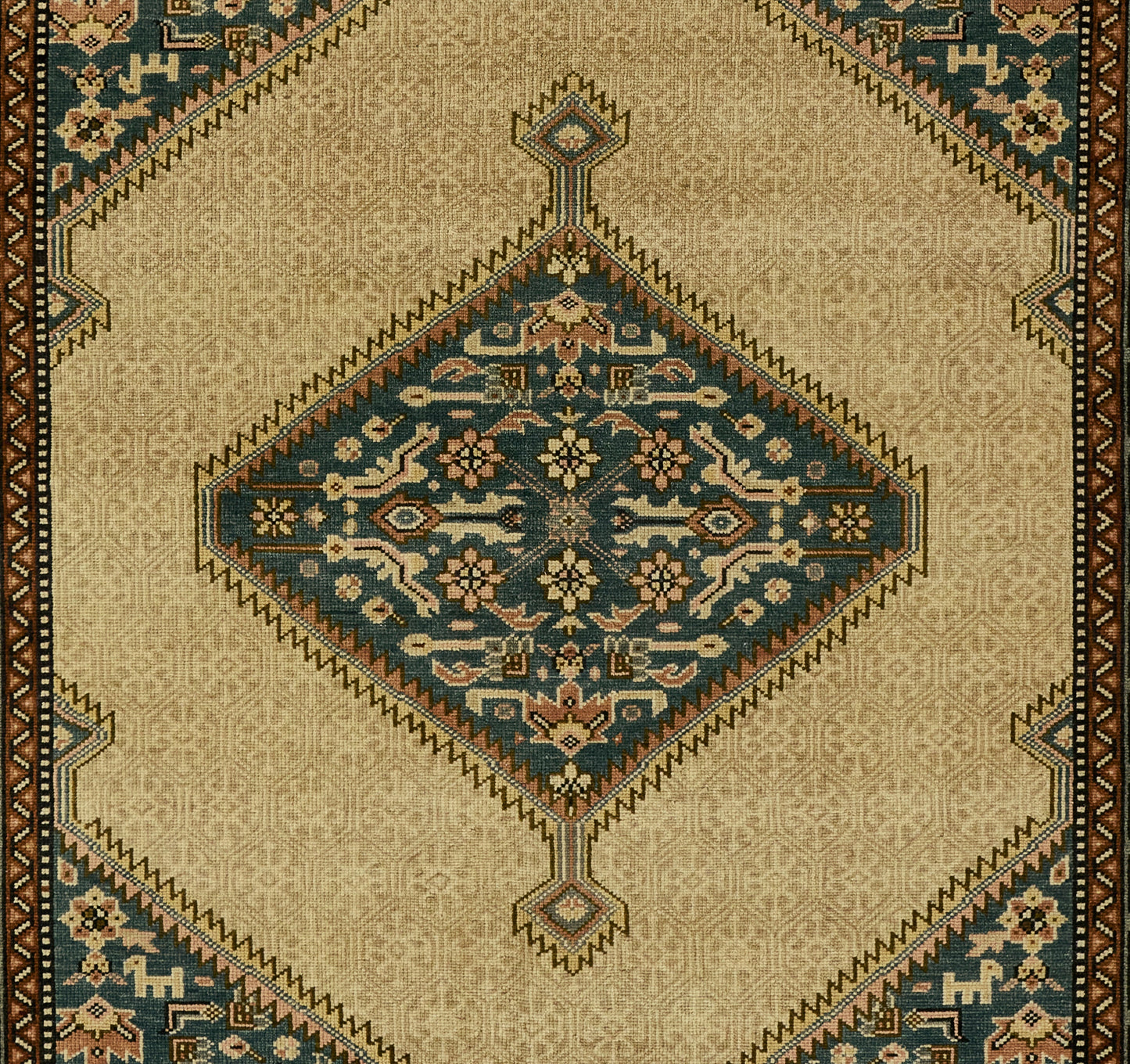 Rectangular beige Oriental rug with central blue diamond medallion, teal accents, floral motifs, and brown patterned border.