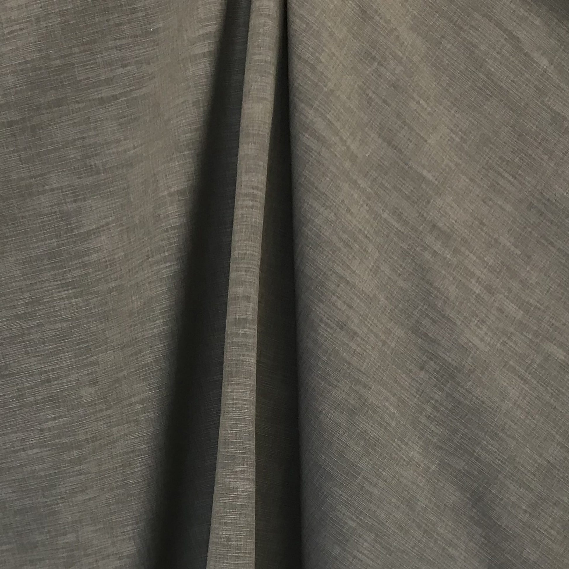 Gray shantung fabric with subtle weave texture, softly draped into curtain-like folds.