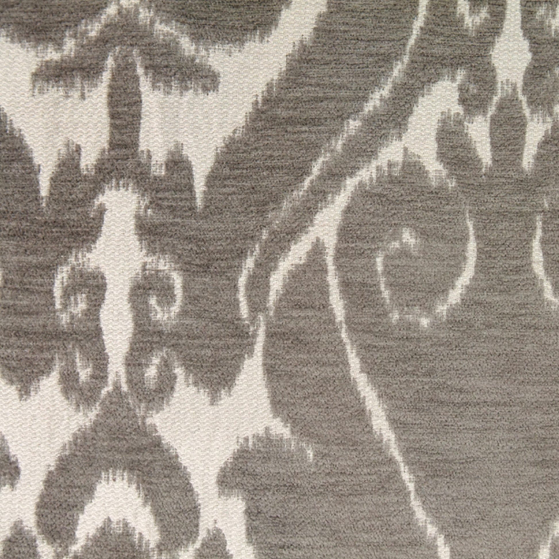Taupe chenille fabric with a beige woven pattern and textured surface; ornate floral-scroll motif suitable for upholstery or rug.