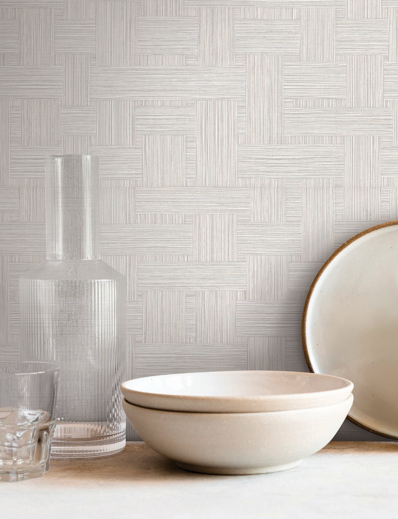 Warm grey wallpaper with a subtle woven texture