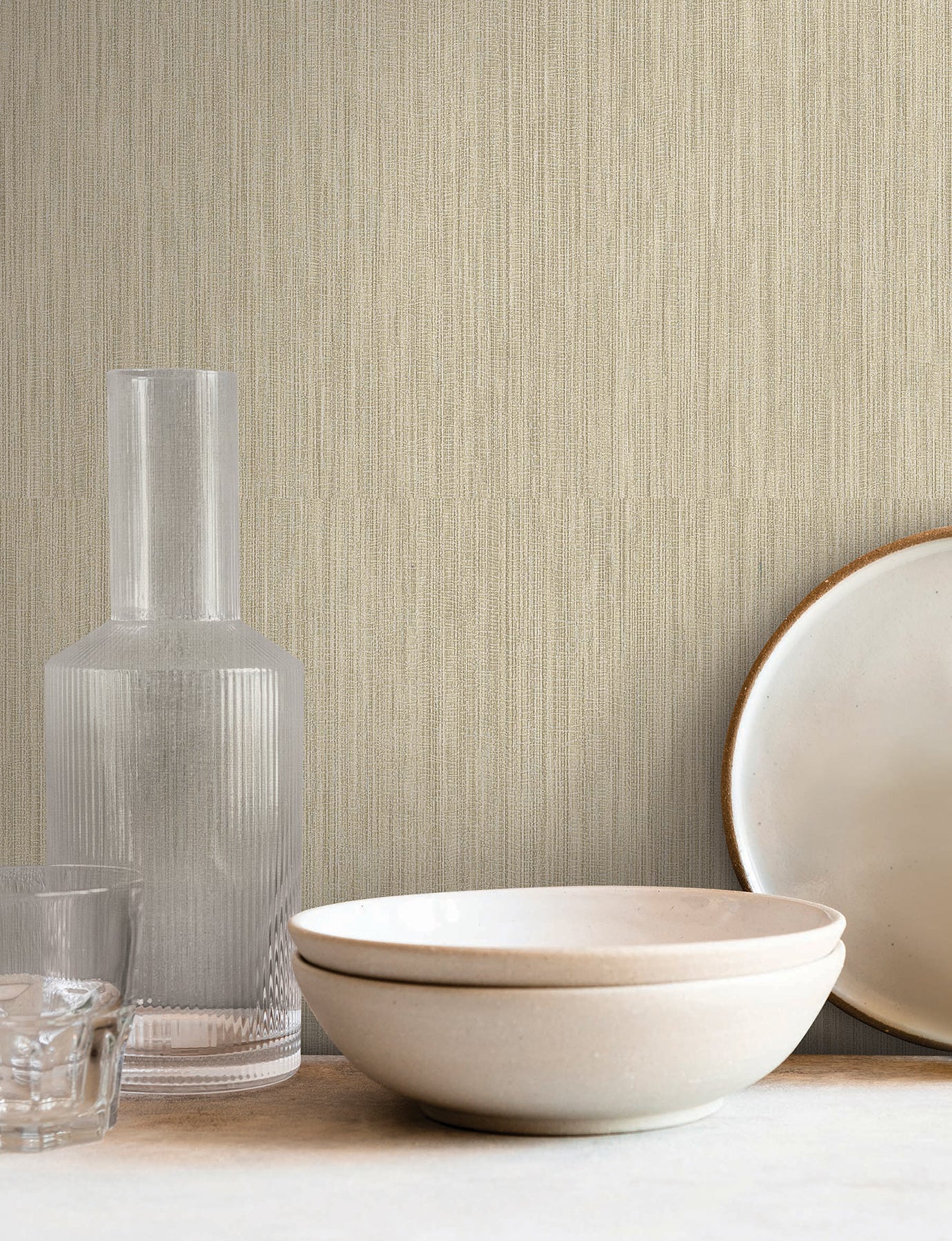 Beige textured wallpaper with a faux grasscloth Lodge Reed pattern.