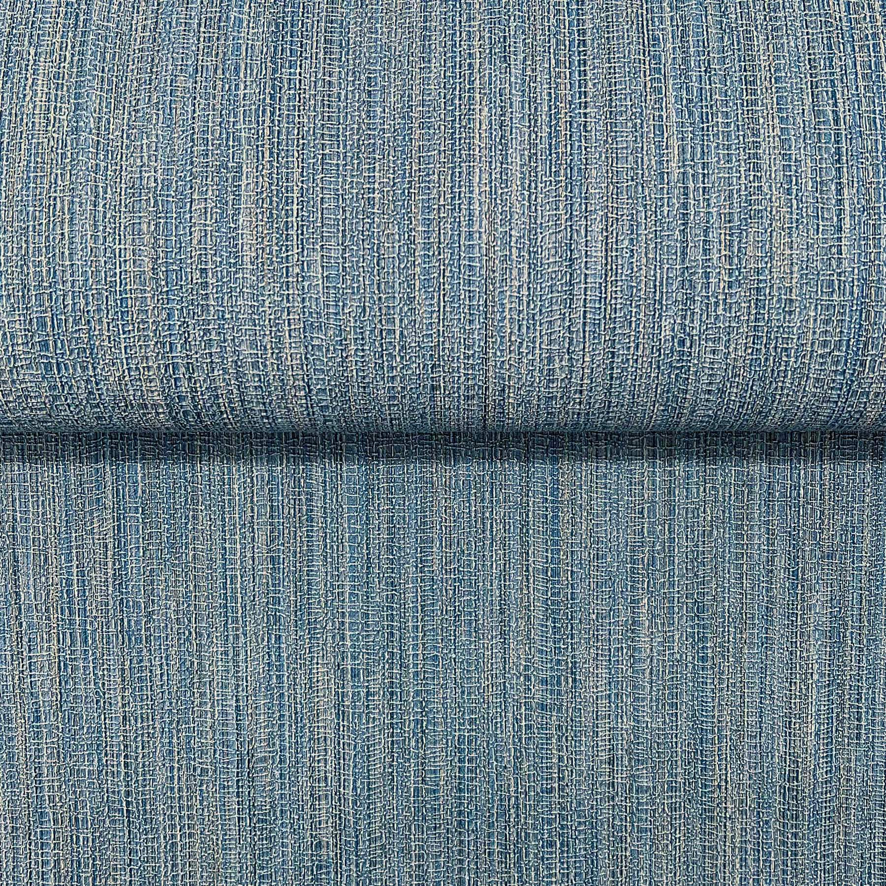Blue denim-like woven fabric with vertical rib texture and subtle beige flecks; folded upholstery swatch.