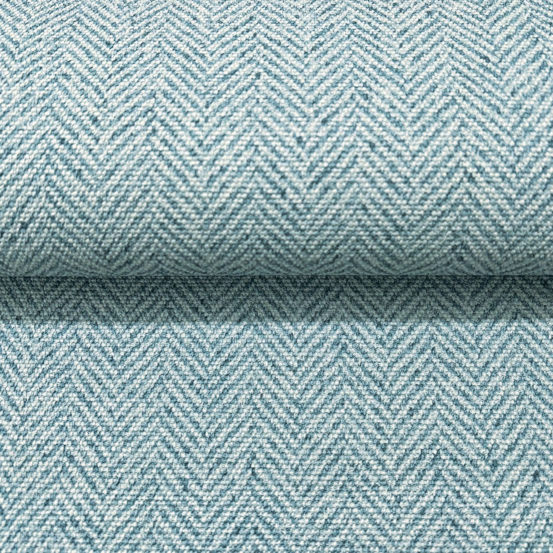 Close-up of light blue chevron wallpaper with a subtle woven texture.