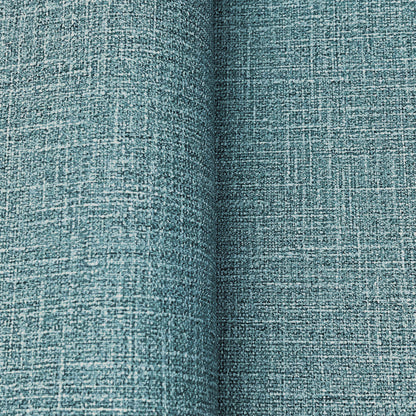Teal woven wallpaper with a linen-like crosshatch texture; close-up detail showing a denim blues wallpaper pattern.