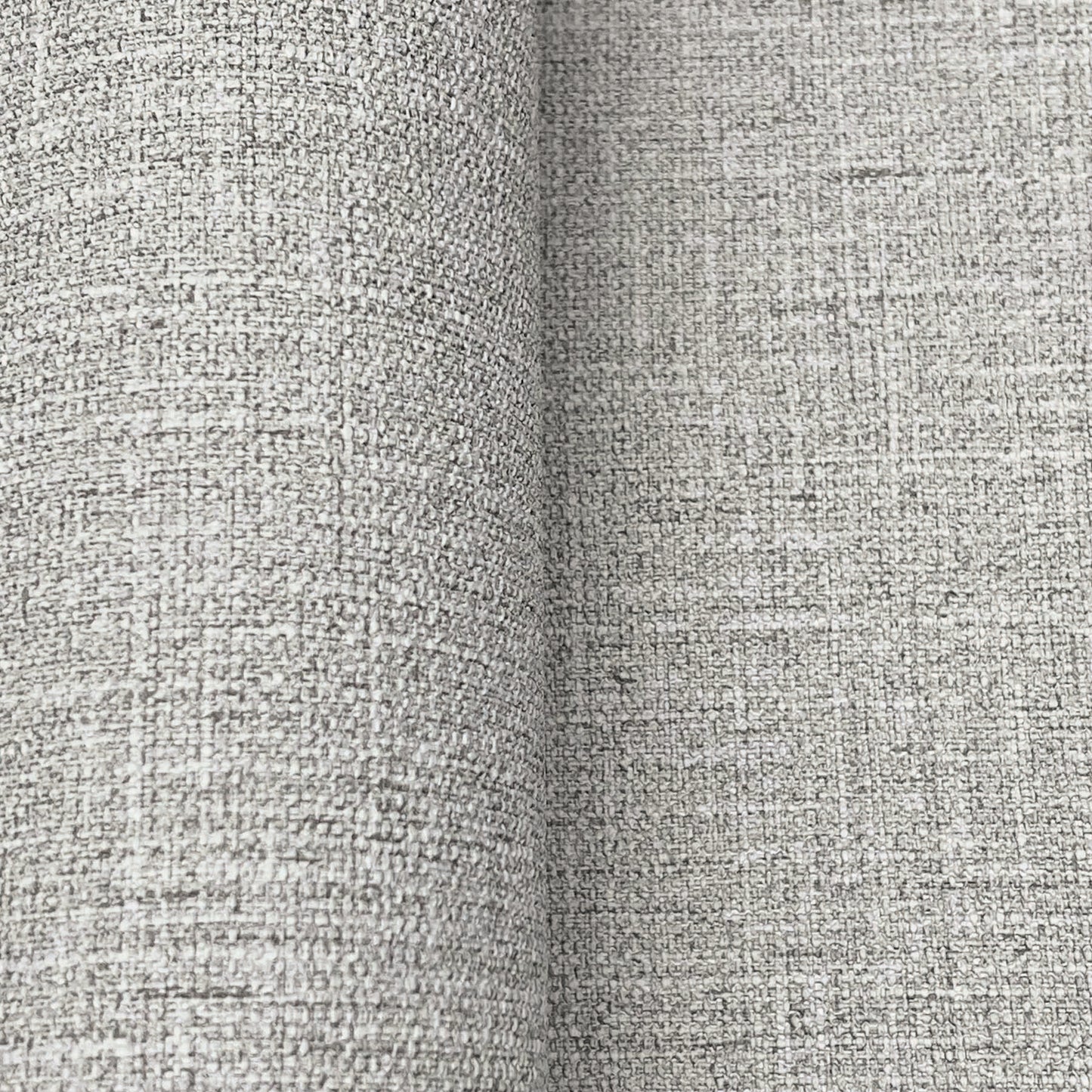 Close-up of dove grey wallpaper with a textured linen-like weave.