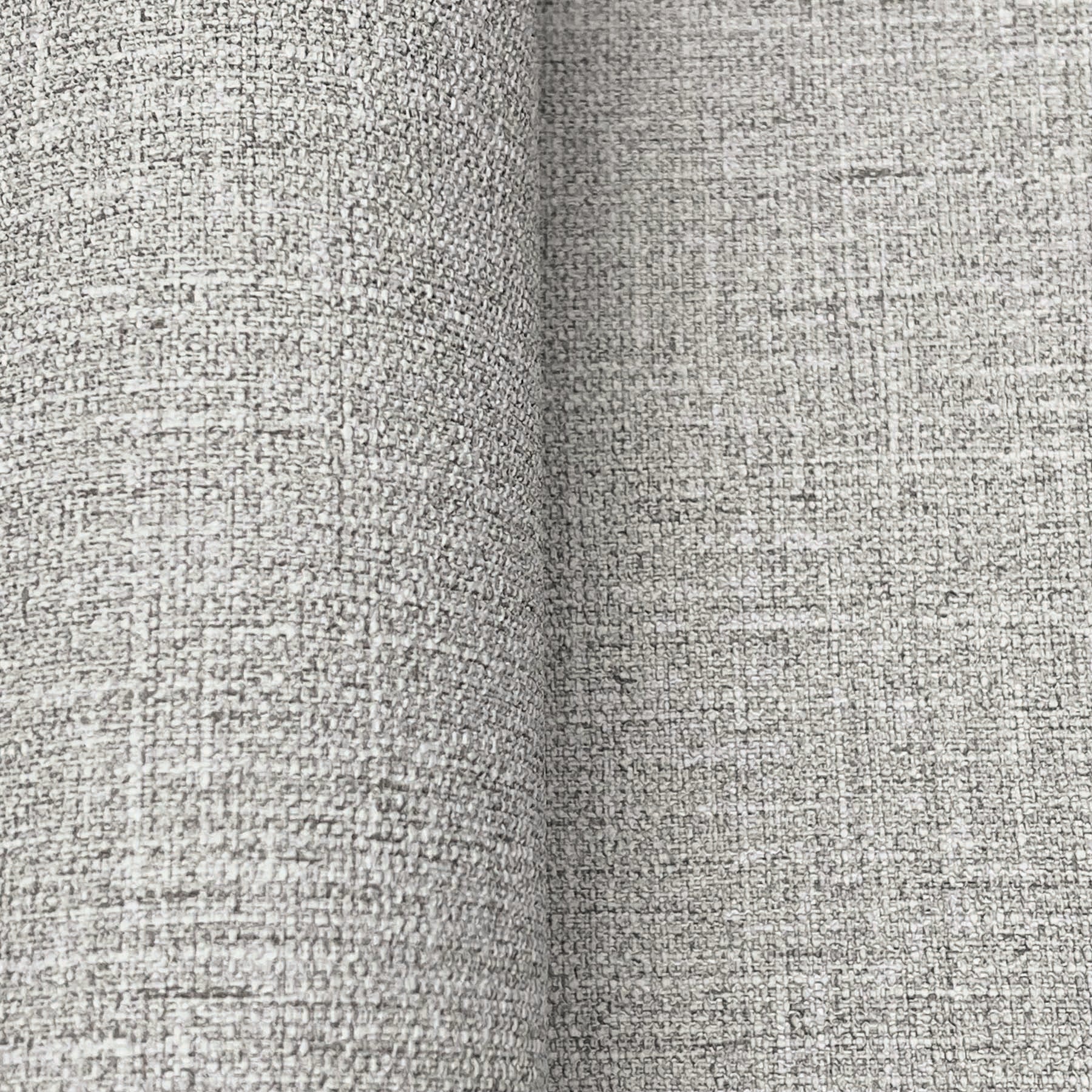 Close-up of dove grey wallpaper with a textured linen-like weave.