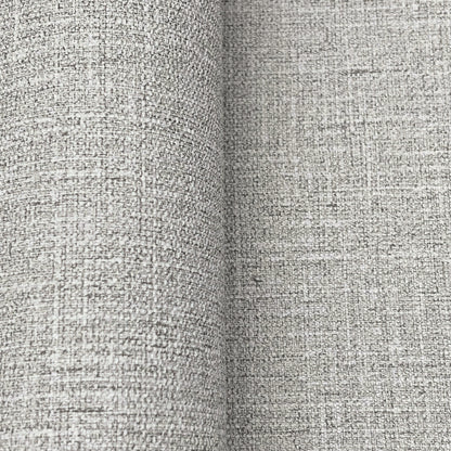 Close-up of dove grey wallpaper with a textured linen-like weave.