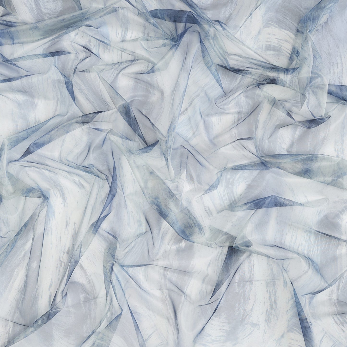 Crinkled sheer fabric swatch in abstract blue, green and teal tones with soft drape.