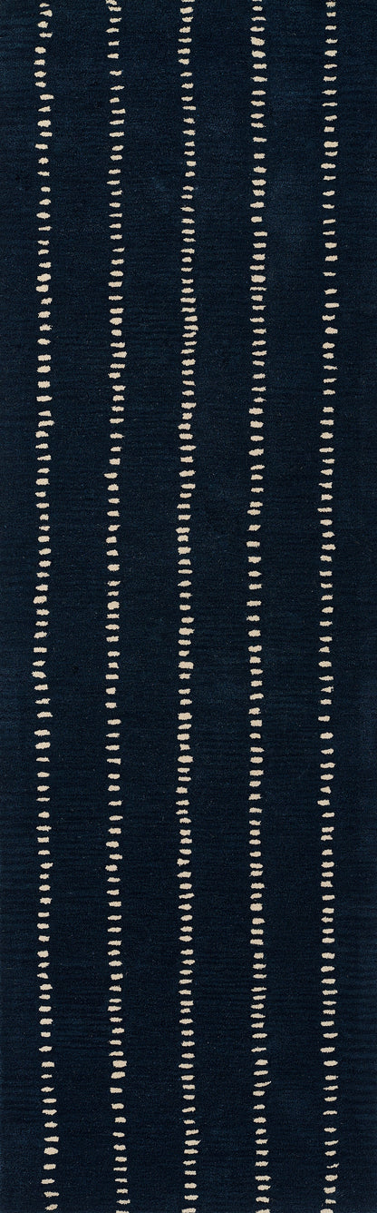 Navy blue rectangular rug with cream vertical dotted stripes and a modern geometric design for the living room.