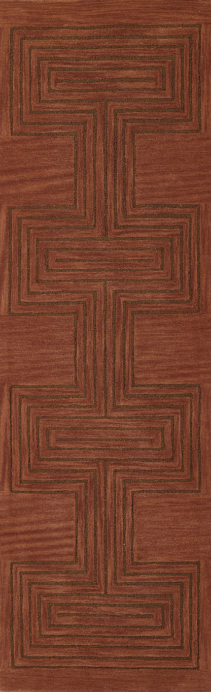 Rectangular red-brown woven rug with dark square-spiral geometric pattern, earthy tribal design.
