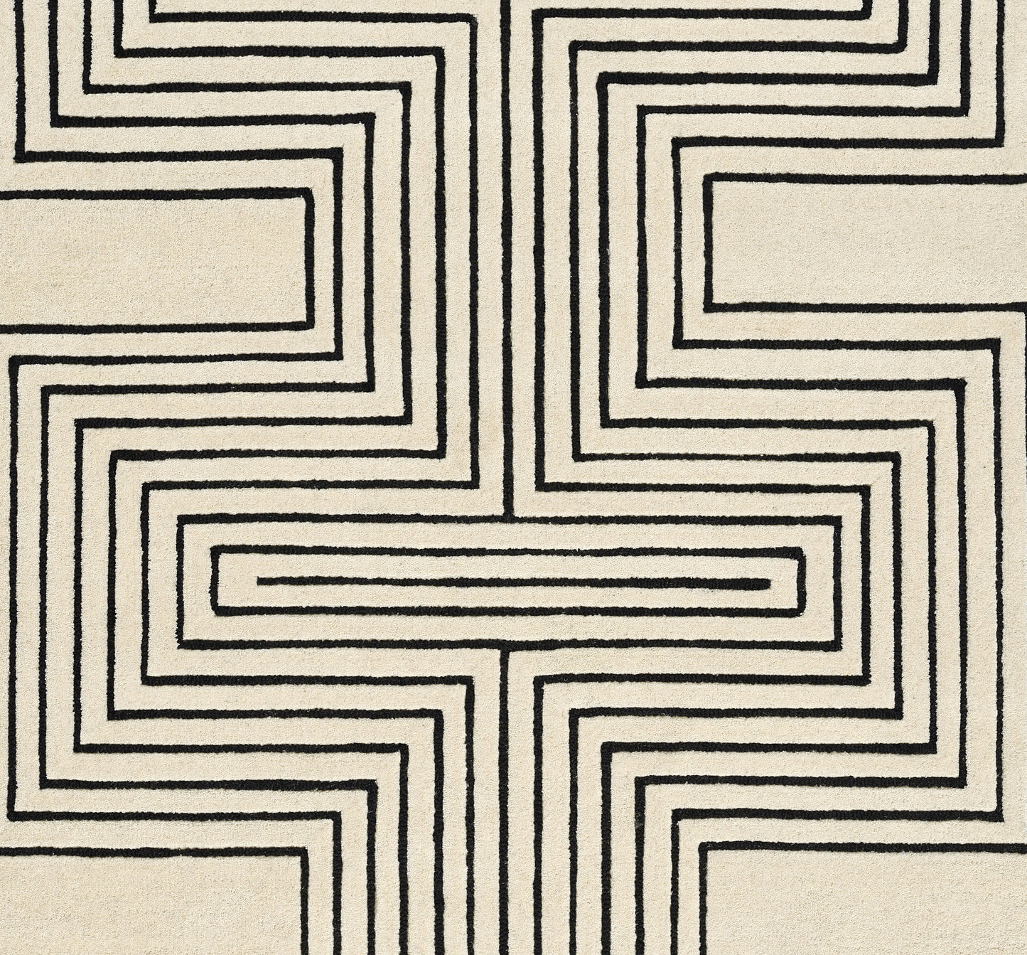 Beige rug with bold black geometric maze lines forming a symmetrical cross pattern; woven texture.
