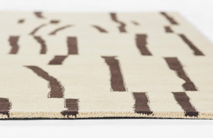 Beige woven rug with brown irregular stripe patterns and fringed edge, contemporary style.