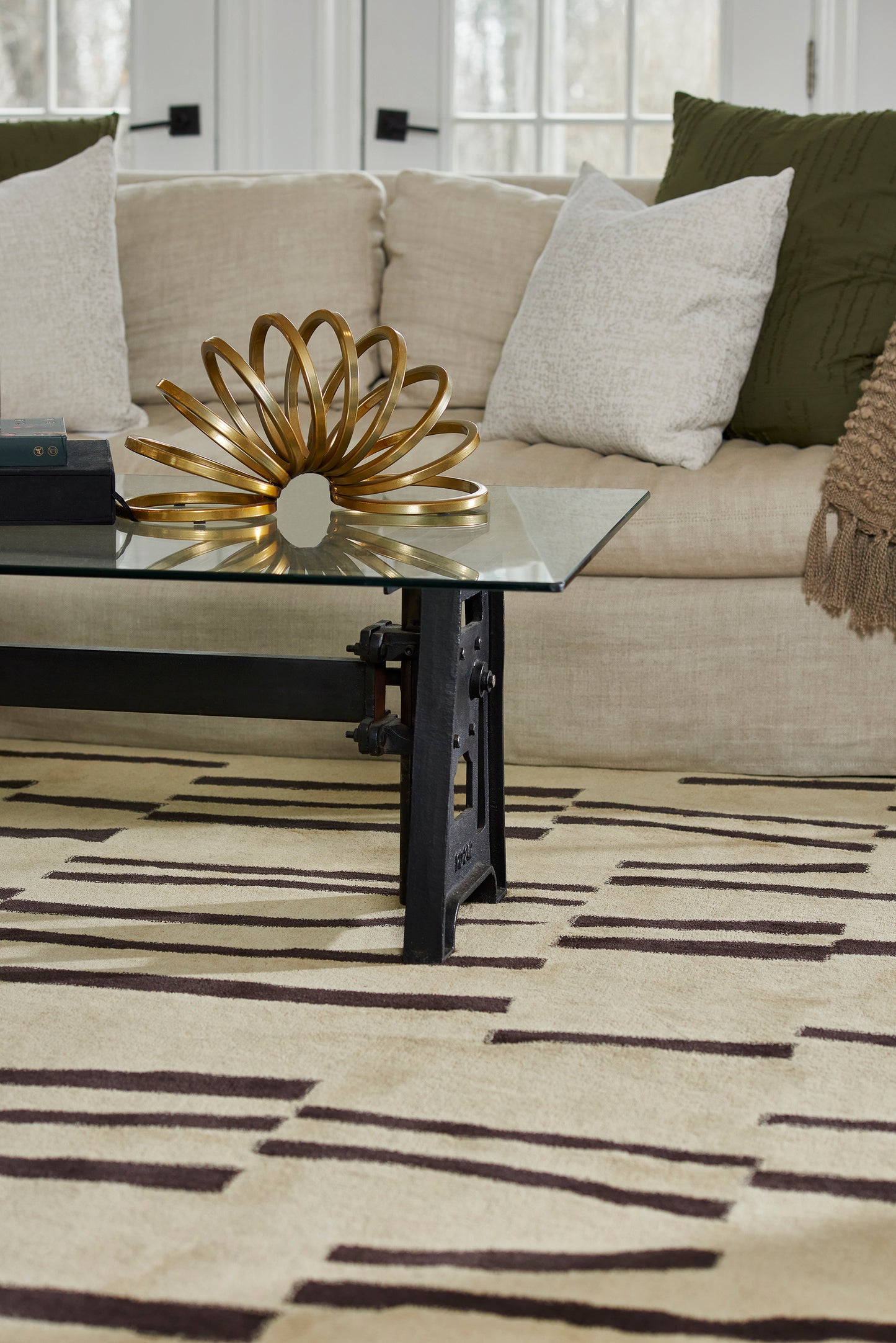 Beige 3' x 8' rug runner laid on the floor in a living room.