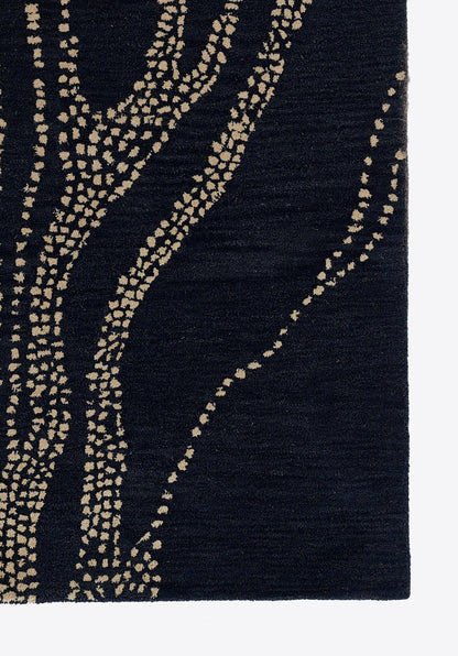 Dark navy rug with beige dotted wavy branch pattern; abstract botanical design.