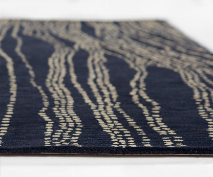 Navy blue rectangular runner rug with cream wavy stripe pattern, modern abstract style.