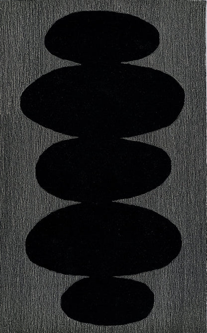 Vertical stack of five smooth black pebble shapes on a charcoal textured surface.