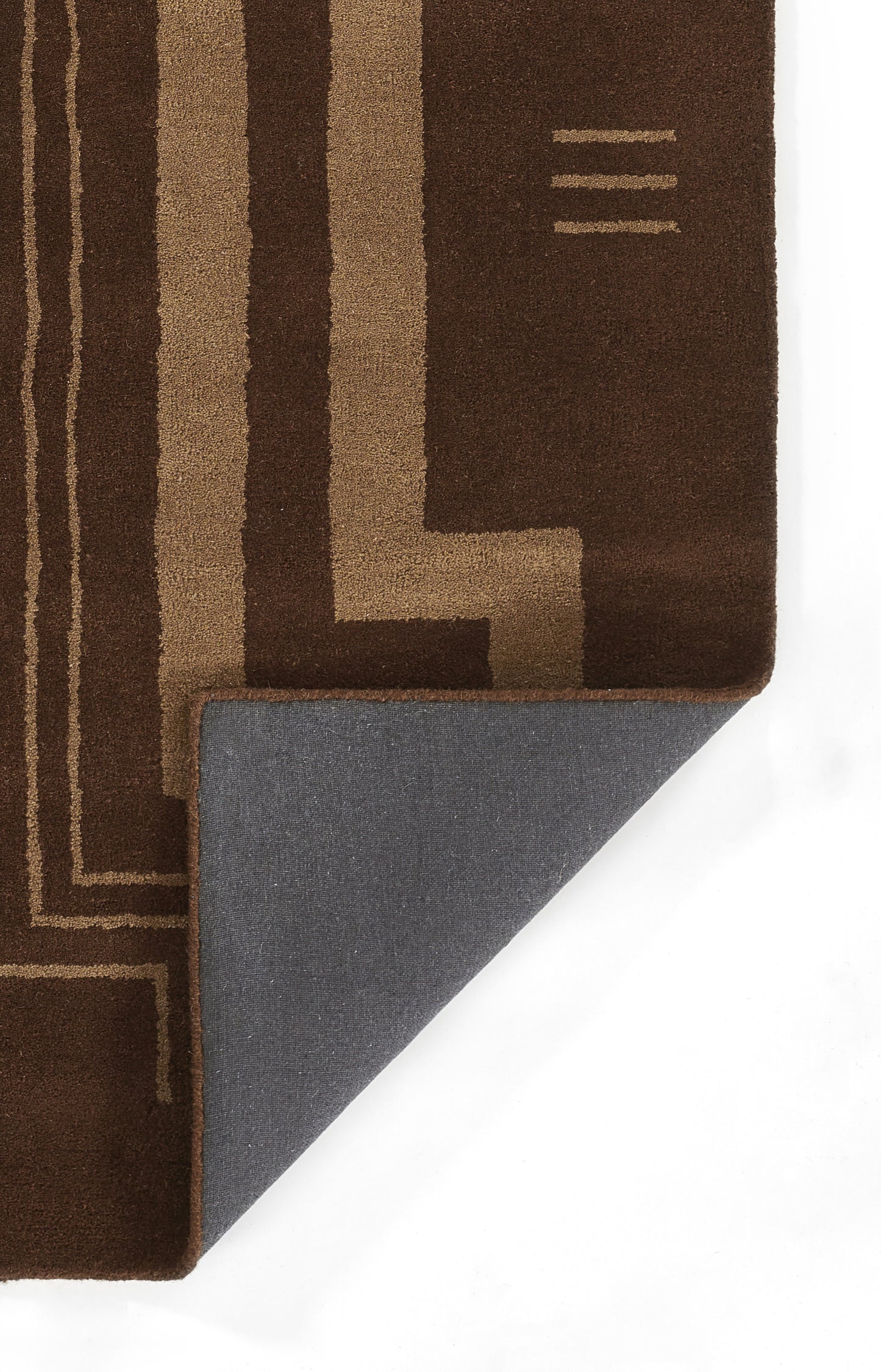 Rectangular brown rug with tan geometric lines; corner folded to reveal gray backing.