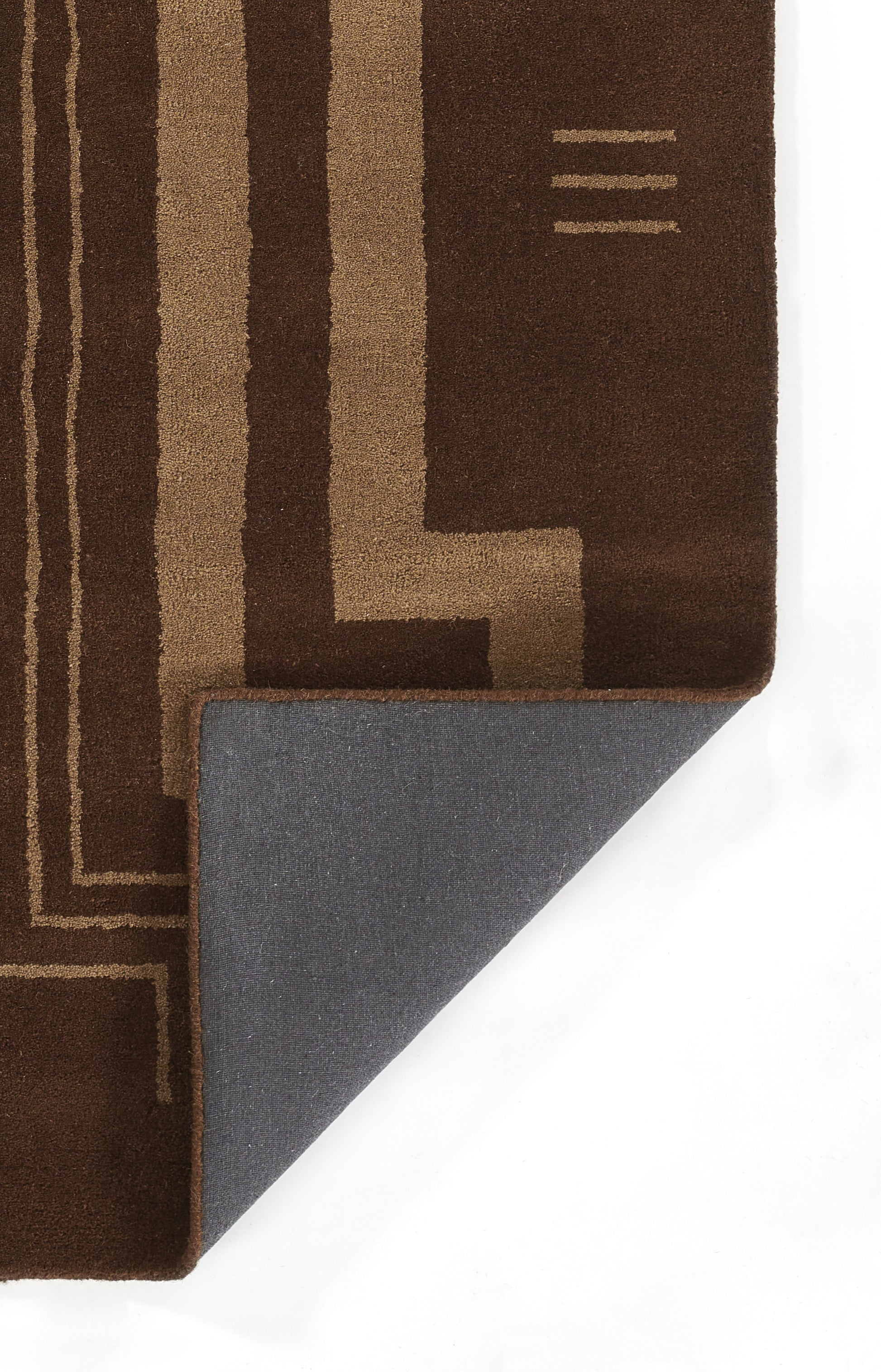 Brown geometric area rug with tan border lines; folded corner reveals blue-gray backing, modern floor decor.