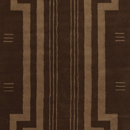 Brown rug with tan geometric pattern, bold vertical central stripes and stepped borders; woven decor for living room.