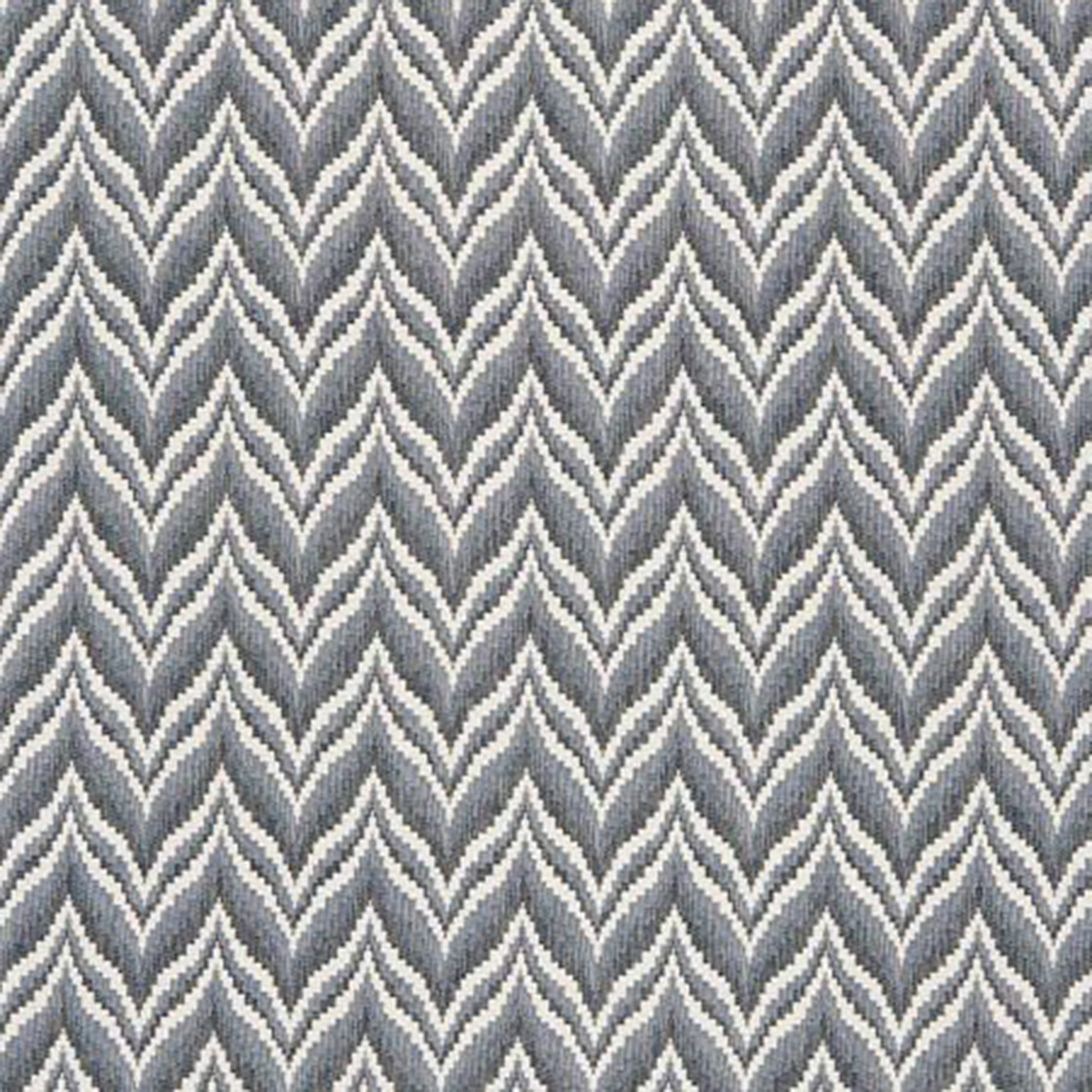 Blue jacquard fabric with a chevron pattern, suitable for upholstery or decor.