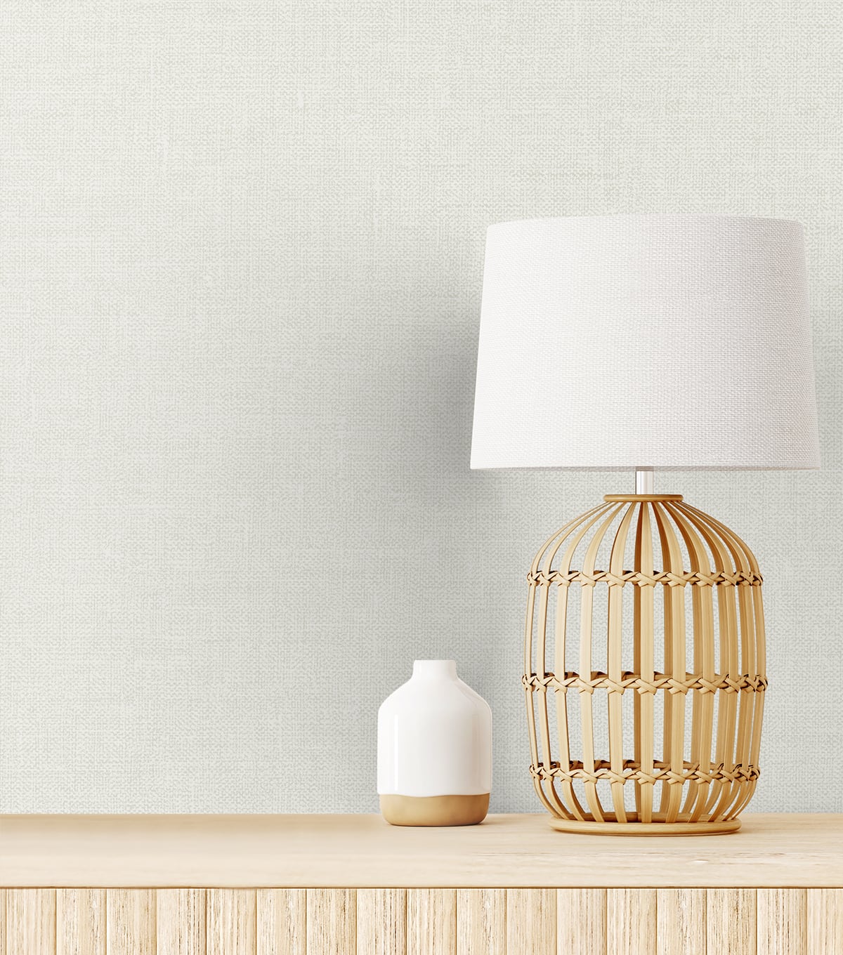 Soft off-white linen fabric swatch on a light wood surface, close-up showing the texture.