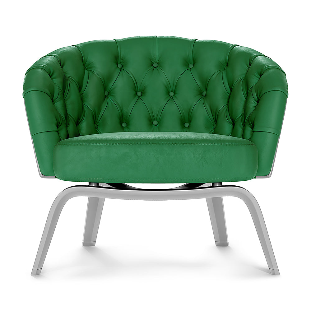 Emerald green tufted fabric lounge chair with rounded back and silver curved metal legs
