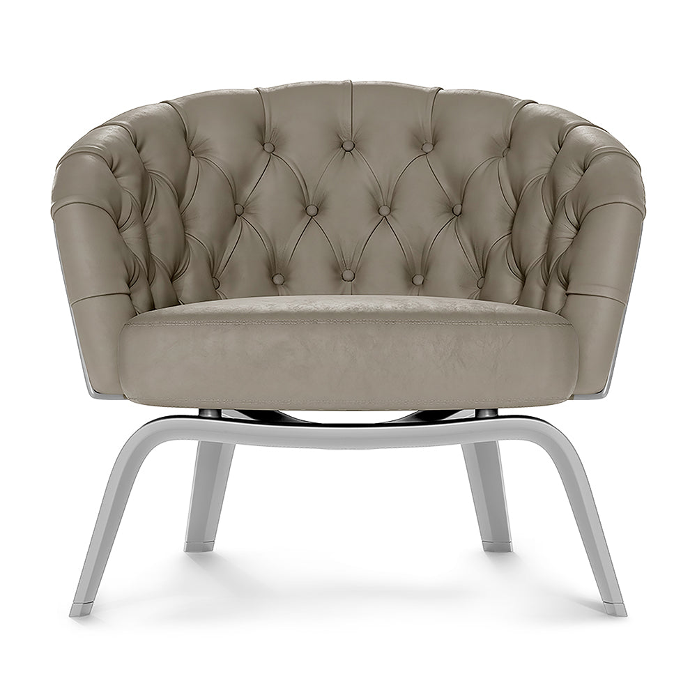 Gray solid fabric tufted barrel chair with button details and chrome curved legs for a modern lounge.