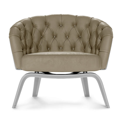 Taupe solid fabric upholstered barrel chair with button-tufted back and curved chrome legs.