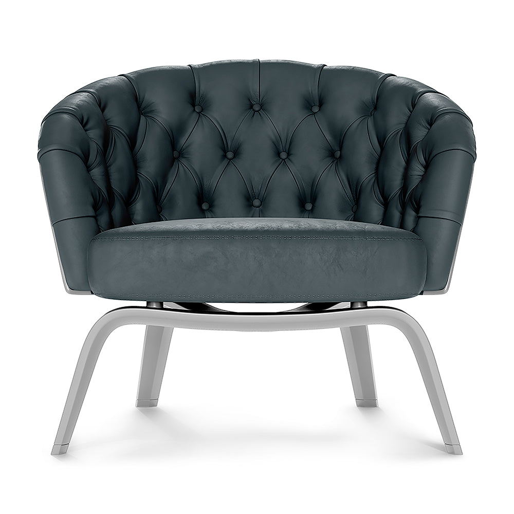 Blue solid fabric club chair with button tufting and gray curved metal legs.