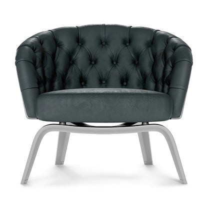 Gray solid fabric tufted barrel chair with curved back and light gray metal sled base.