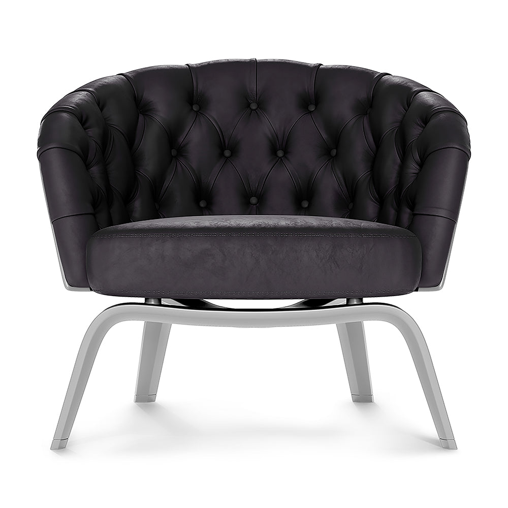Purple solid fabric chair with curved arms.