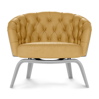 Yellow solid fabric tufted barrel chair with curved back and round cushion on silver metal legs.