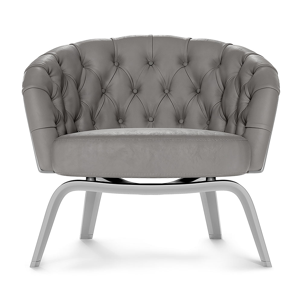 Grey fabric tufted barrel lounge chair with curved arms and metal curved legs.