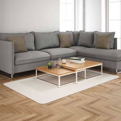 Mocha solid fabric sectional sofa in a modern living room with brown and gray cushions, two-tier wooden coffee tables on a light rug.