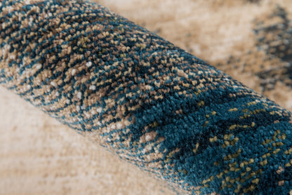 Rolled high-pile shag rug in navy, teal and beige; plush, speckled floor decor.