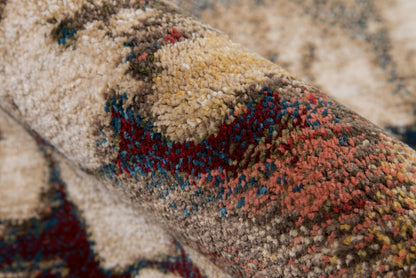 Close-up of a multicolor shag rug with beige base, red, blue, teal pattern; tufted pile, woven Persian-inspired area rug.