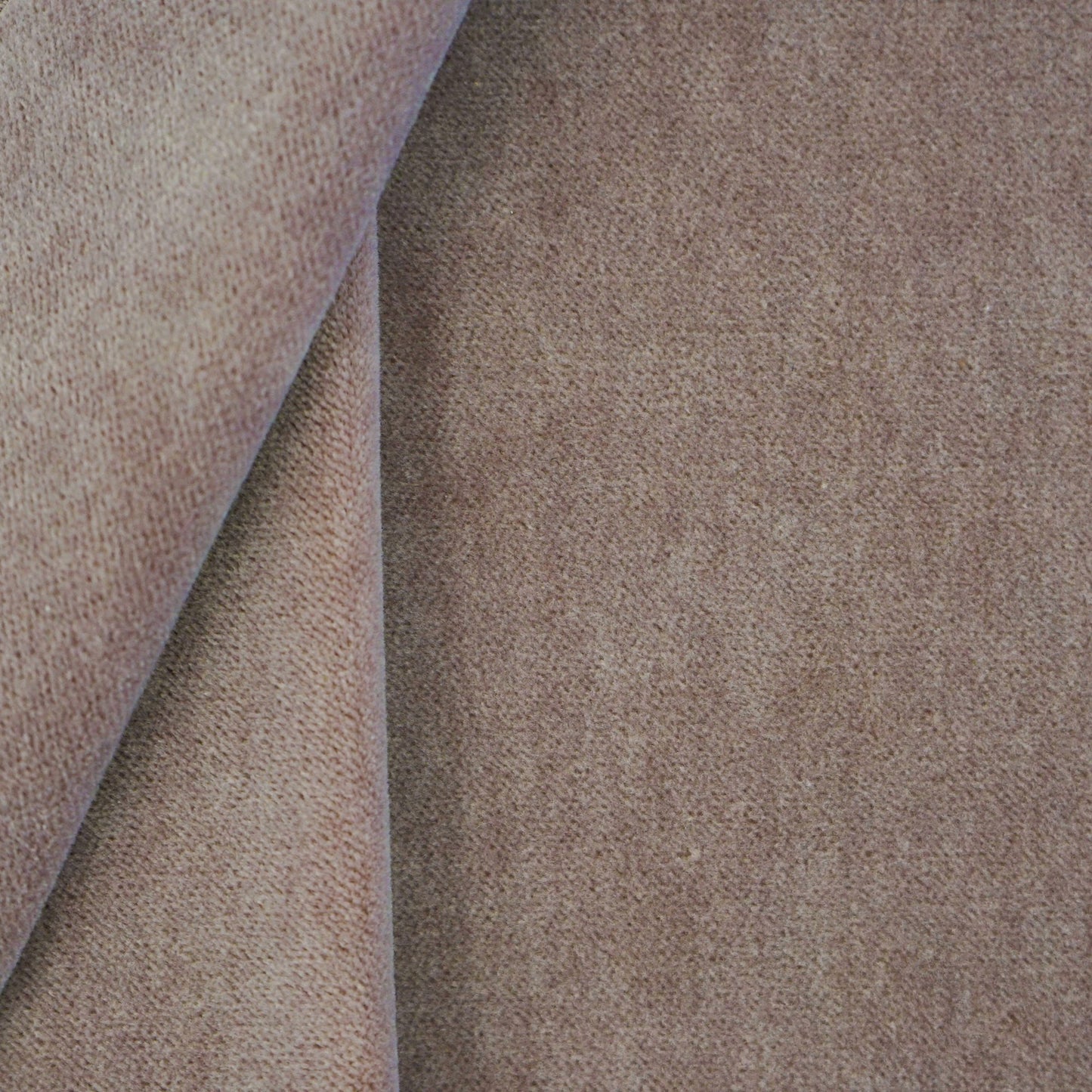 Purple velvet fabric with a soft nap and a folded corner; close-up texture for upholstery or fashion.