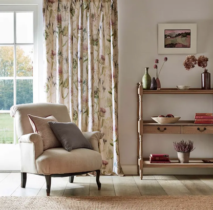 Sanderson Thistle Garden linen fabric (DEBB226423) showing printed thistle and seed‑pod motifs in soft fig tones and natural linen background — ideal for upholstery, draperies, cushions and interior design projects.