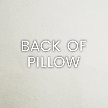 Back of pillow label: bold white text with subtle shadow on pale gray surface.