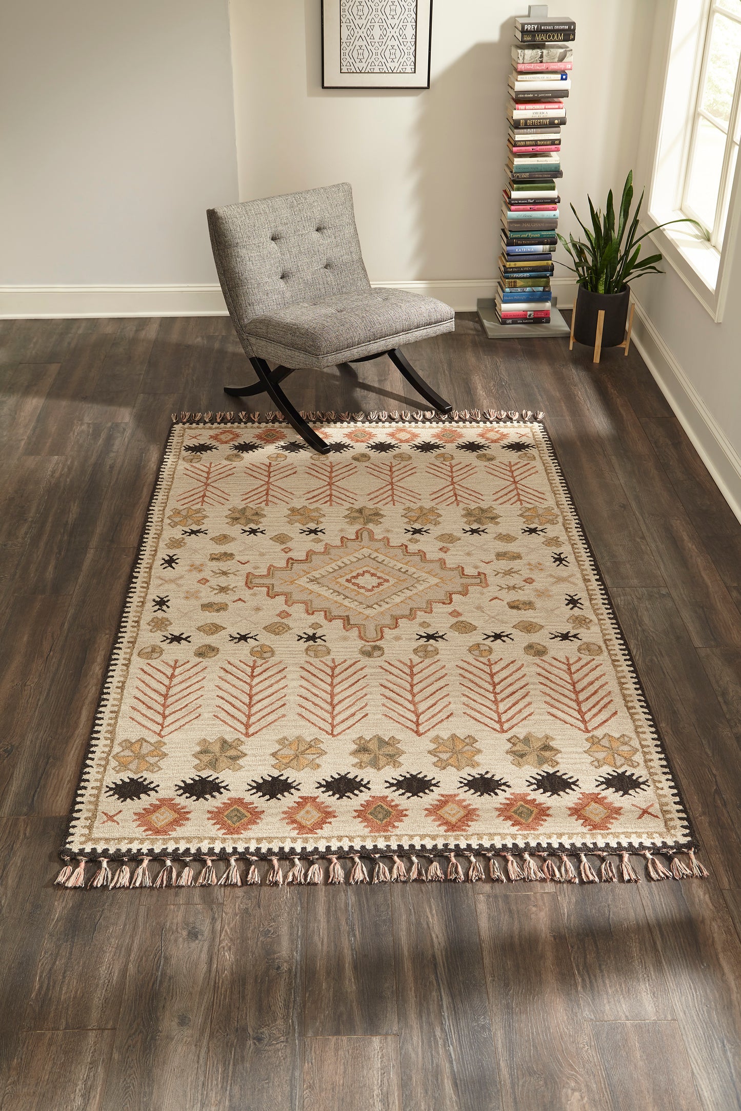 Cream Southwestern rug with geometric motifs and fringe in a sunny room, sized 7'6" x 9'6".