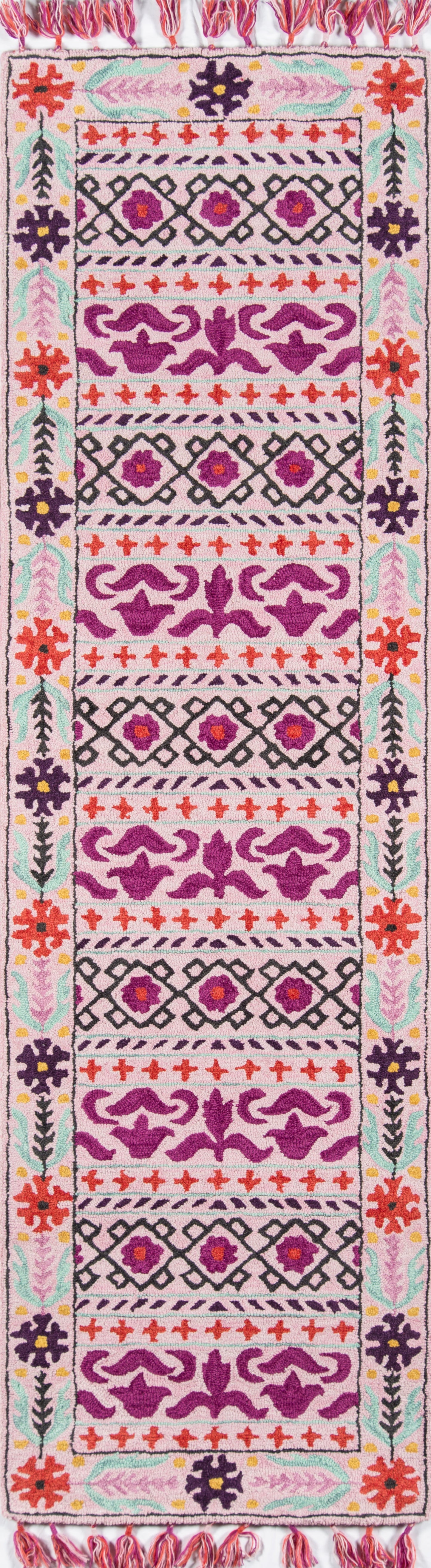 5' x 8' woven area rug in pink, purple, red & teal with geometric & floral motifs; fringed ends.