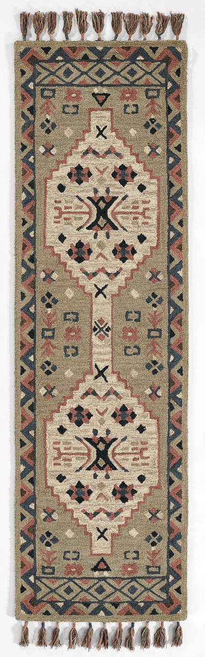 Kilim-style woven runner rug with geometric medallions and tassel fringe in beige, gray, navy, and dusty red.