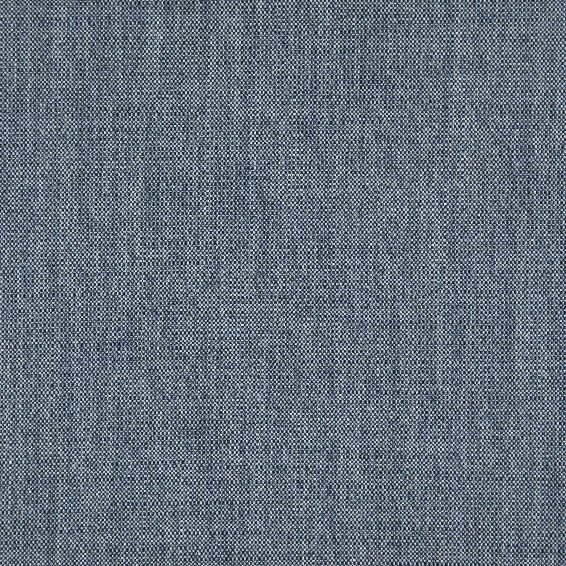 Blue jacquard fabric close-up with linen texture.