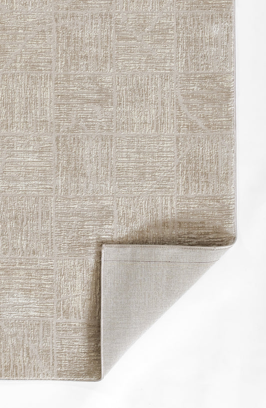 Beige textured runner rug with square patchwork pattern and soft pile; folded corner reveals lighter underside.