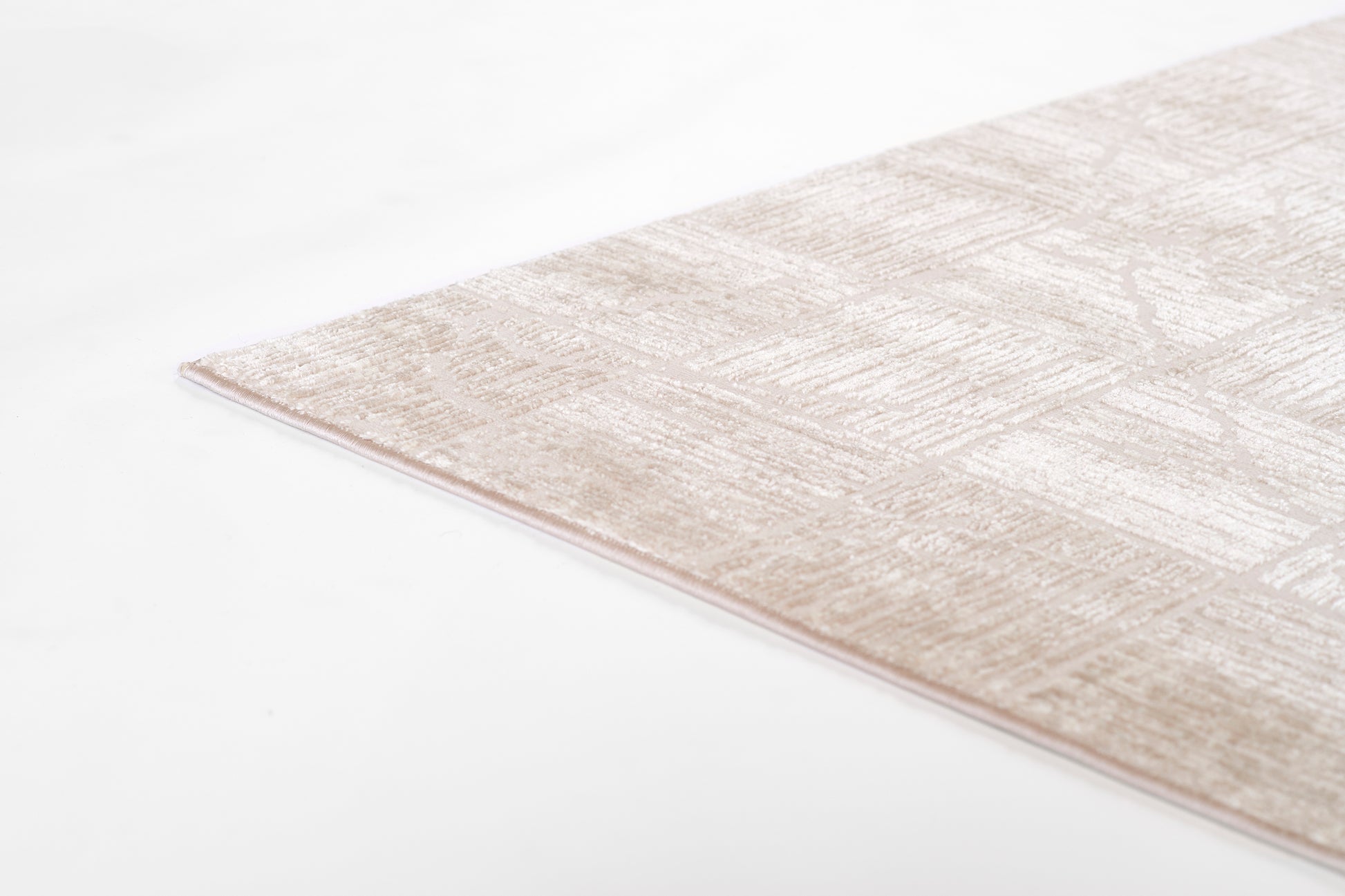 Beige textured runner rug with a subtle geometric pattern, soft pile, rectangular shape, modern style, 2' x 8'.