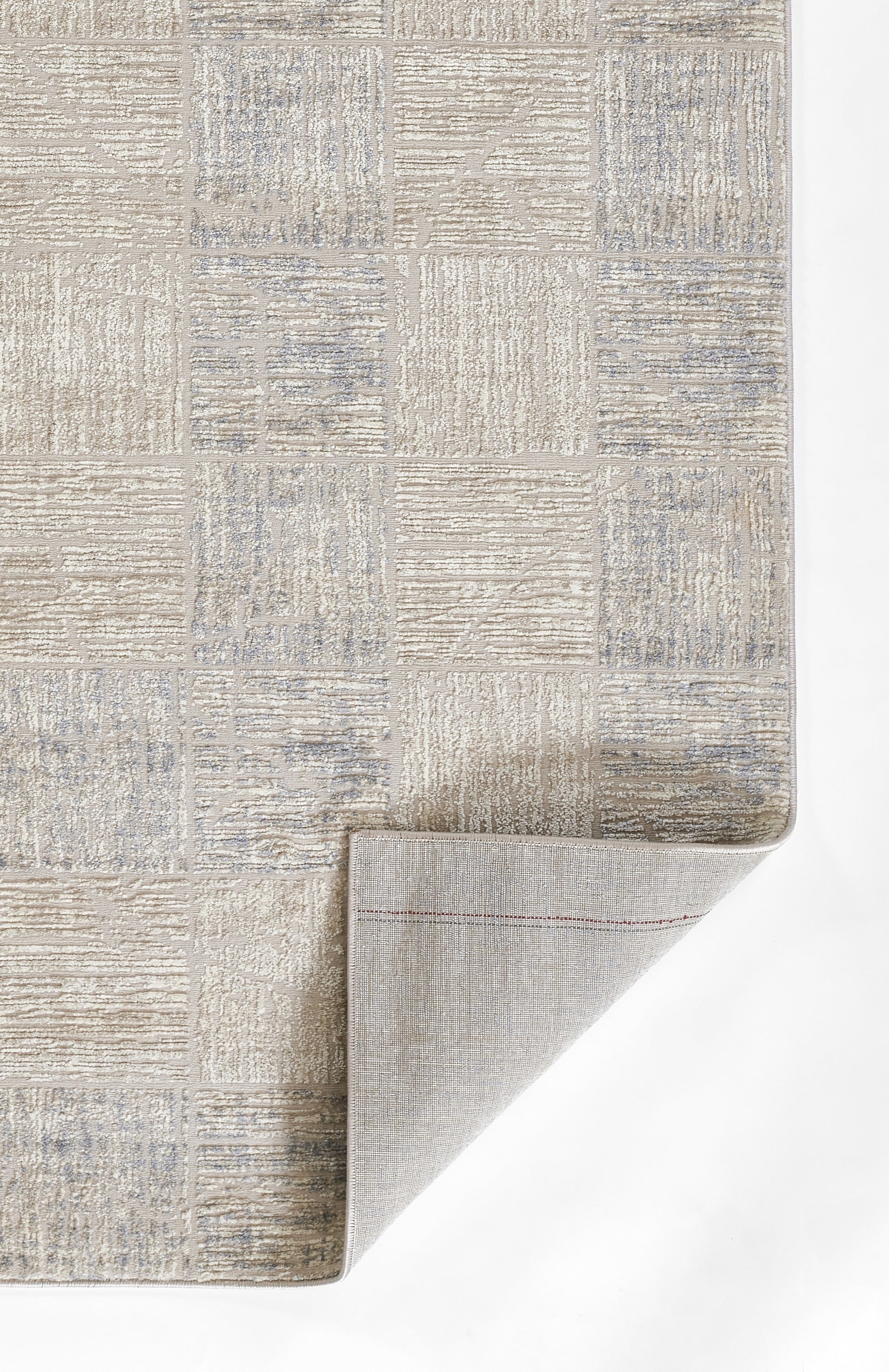 Beige & pale blue patchwork textured runner; woven pattern, folded corner shows underside, neutral modern style, 2' x 8'.